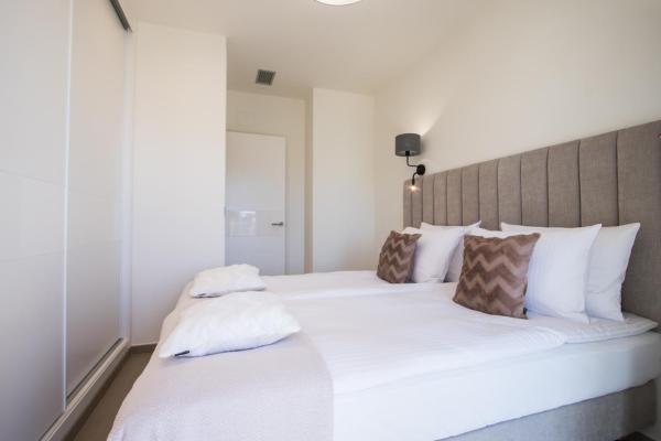 Cama o camas de una habitación en INTEMPO SKY Resort 162
