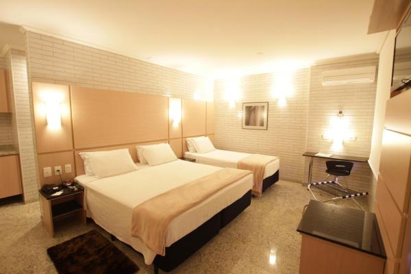 Cama o camas de una habitación en Hotel Confiance Centro Cívico