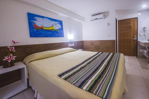 Cama o camas de una habitación en Hotel Corais de Tambau