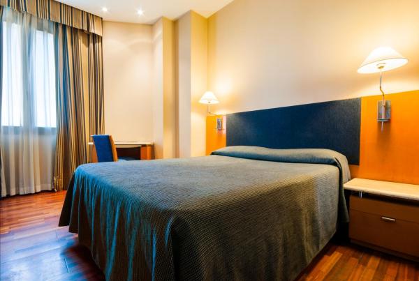 Cama o camas de una habitación en Hotel Villacarlos