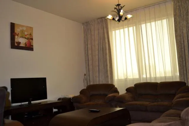  Abu Dhabi Plaza Hotel Apartments - picture  : Seating area,TV/entertainment centre,Day,Living room,Property 