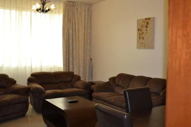  Abu Dhabi Plaza Hotel Apartments - picture  : Seating area,Day,Living room,Property 