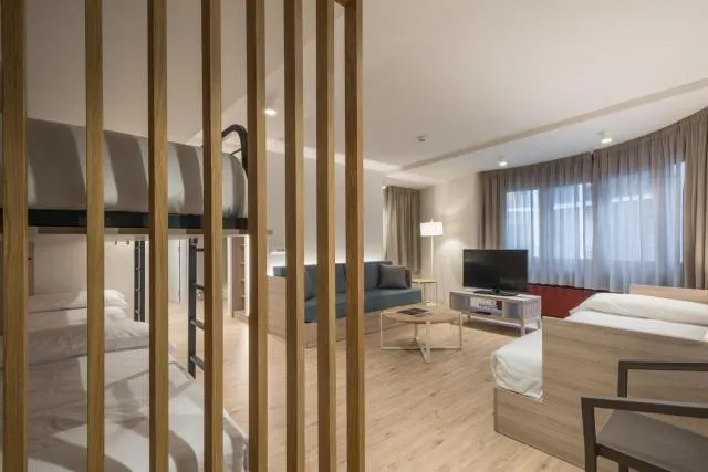  Hotel & Aparthotel Cosmos - picture  : Seating area,TV/entertainment centre,Photo of the whole room,Room 