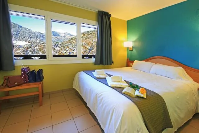  Apartaments Giberga - picture  : Bed,Bed,Mountain view,Photo of the whole room,Bedroom,Mountain view,Property,Room 