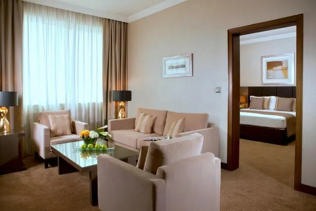  Ramada Downtown Abu Dhabi - picture  : Seating area,Bed,Living room,Property,Room 