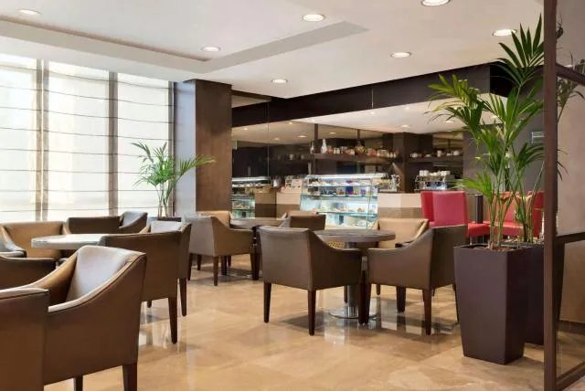  Ramada Downtown Abu Dhabi - picture  : Toilet,Patio,Restaurant/places to eat,Dining area,On site,Property 