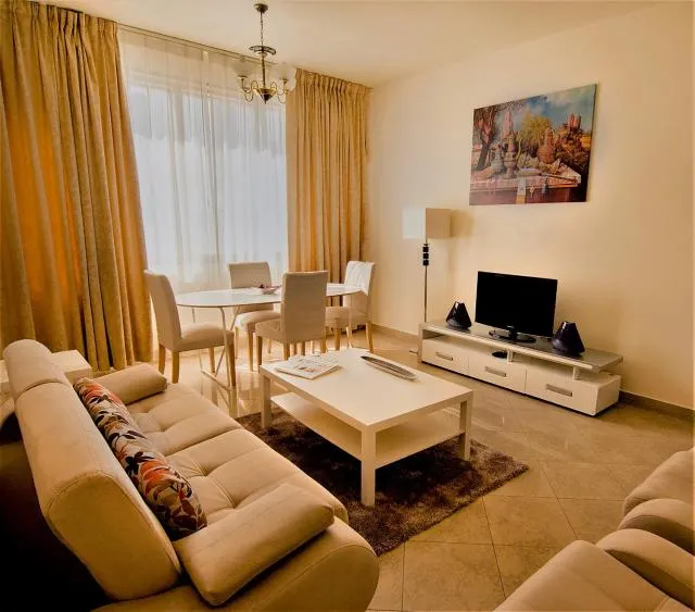  Abu Dhabi Plaza Hotel Apartments - picture  : Seating area,TV/entertainment centre,Living room,Property 