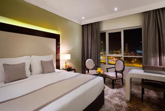  Elite Byblos Hotel - picture  : Bed,Bed,View (from property/room),Photo of the whole room,Seating area,Bedroom,City view,hair dresser,Property,Room 