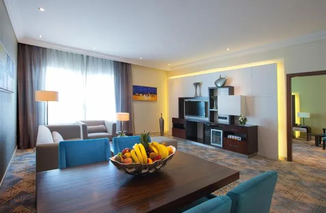  Elite Byblos Hotel - picture  : Seating area,Day,TV and multimedia,Living room,Decorative detail,Seating area,Dining area,Food,Family,oven,Property 