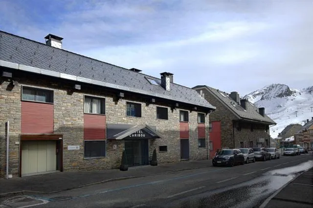  Hotel Caribou - picture  : Property building,Facade/entrance,Property building,Aqua park,Time of day,Sunrise,Property 