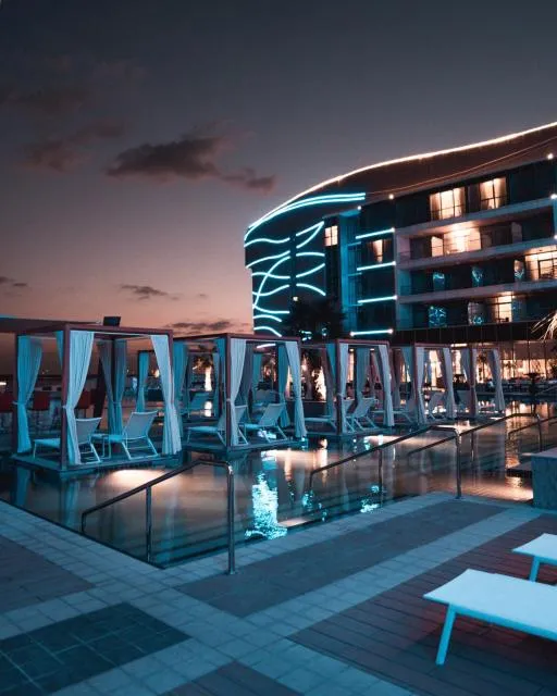  Royal M Hotel & Resort Abu Dhabi - picture  : Property building,Property building,Night,Evening entertainment,Pool view,Swimming pool,Property 
