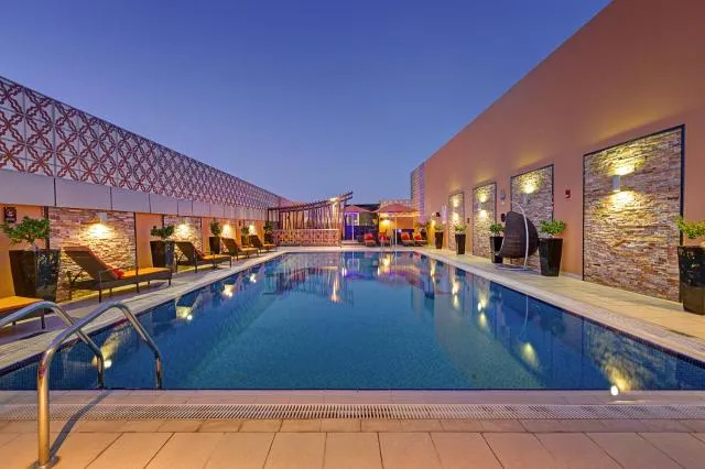  Abidos Hotel Apartment Dubai Land - picture  : Property building,Swimming pool,Swimming pool,Property 