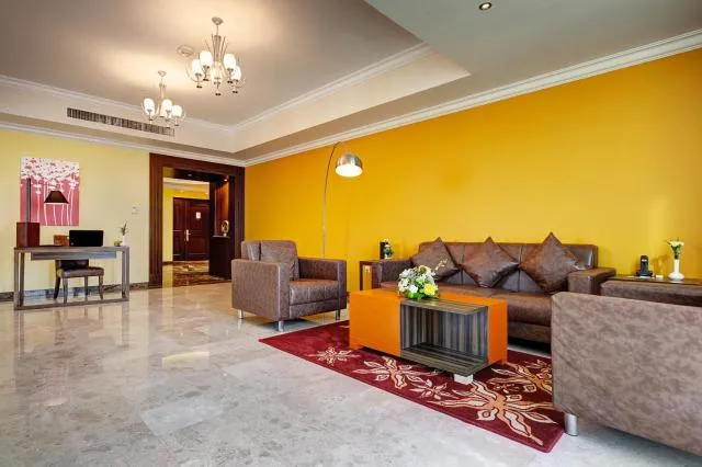  Abidos Hotel Apartment Dubai Land - picture  : Nearby landmark,Seating area,Living room,Property 