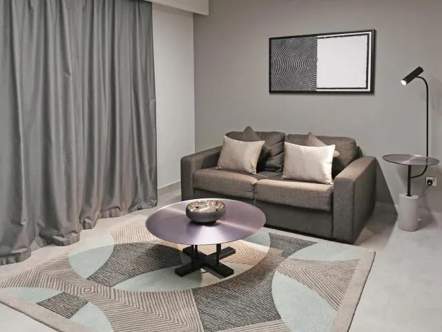  Hotel Holiday International - picture  : Seating area,Living room,Seating area,Property 