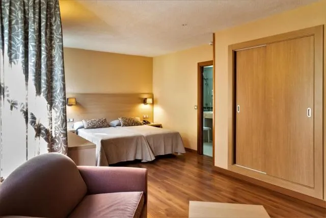  Hotel Panorama - picture  : Bed,Bed,Seating area,Bedroom,Facility for disabled guests,Property,Room 