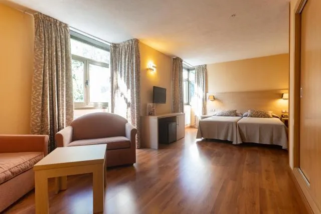  Hotel Panorama - picture  : Seating area,TV and multimedia,Photo of the whole room,Seating area,Bedroom,Facility for disabled guests,Property,Room 