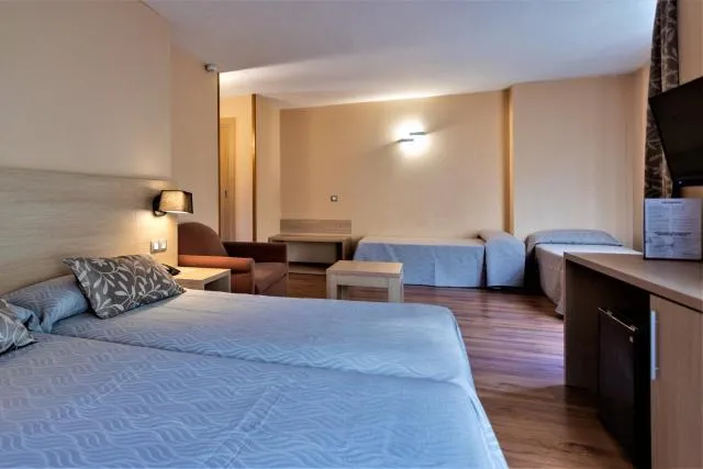  Hotel Panorama - picture  : Bed,Bed,TV and multimedia,Seating area,Bedroom,Property,Room 