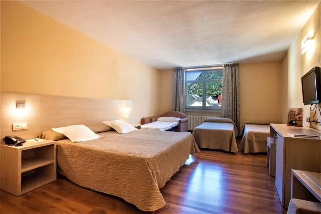  Hotel Panorama - picture  : Bed,Bed,TV and multimedia,Seating area,Bedroom,Property,Room 