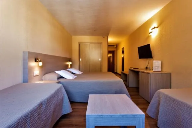  Hotel Panorama - picture  : Bed,Bed,TV and multimedia,Photo of the whole room,Seating area,Area and facilities,Property,Room 