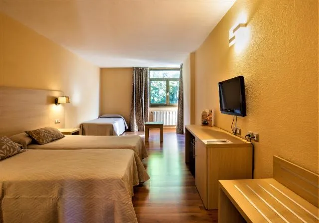  Hotel Panorama - picture  : TV/entertainment centre,Bed,TV and multimedia,Photo of the whole room,Seating area,Property,Room 