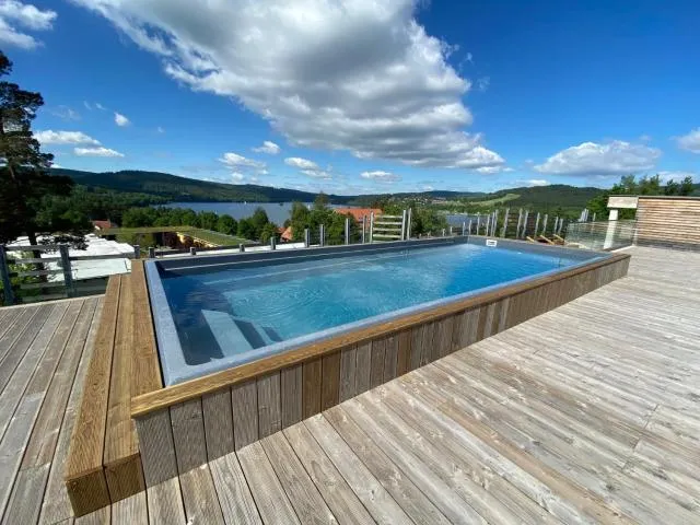  JBX Resort Apartments Lipno - picture  : Swimming pool,Pool view,Summer,Spa and wellness centre/facilities,Lake view,Swimming pool,Property 