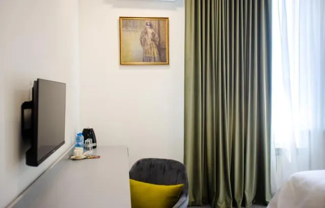  Aurora Hotel By Benefice - picture  : TV/entertainment centre,TV and multimedia,Living room,Seating area,Property 