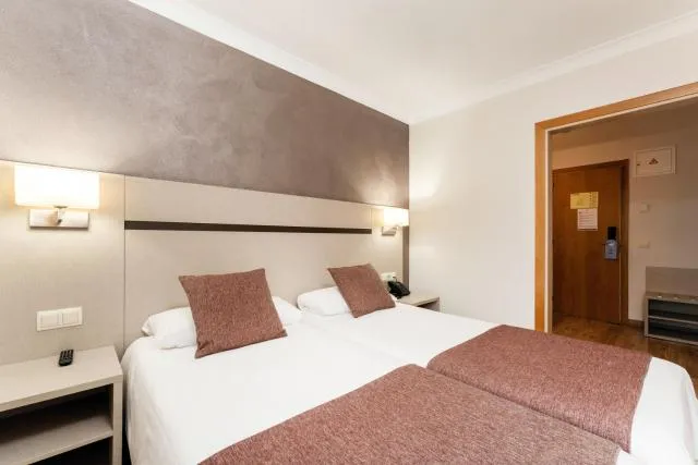  Hotel & Aparthotel Cosmos - picture  : Bed,Bed,Photo of the whole room,Bedroom,Property,Room 