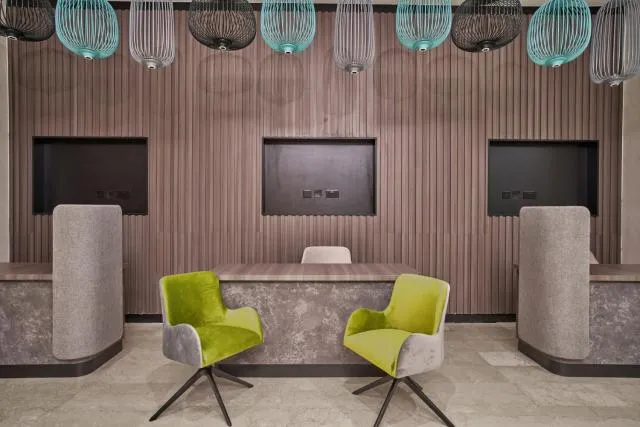  Hotel Holiday International - picture  : Seating area,TV/entertainment centre,Seating area,Property 