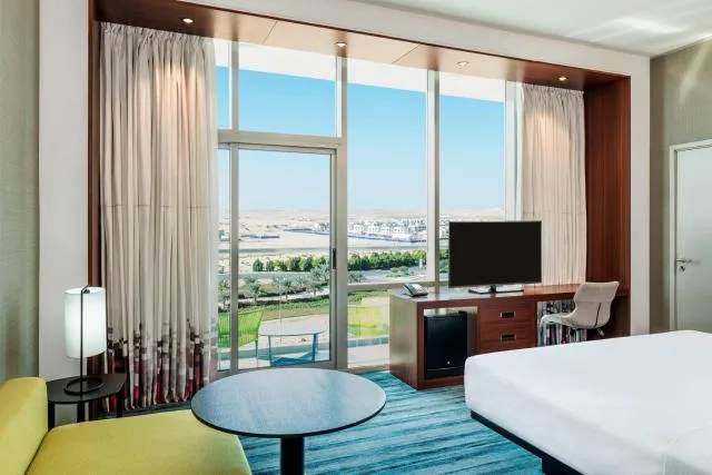  Aloft Dubai South - picture  : TV/entertainment centre,Photo of the whole room,Room 