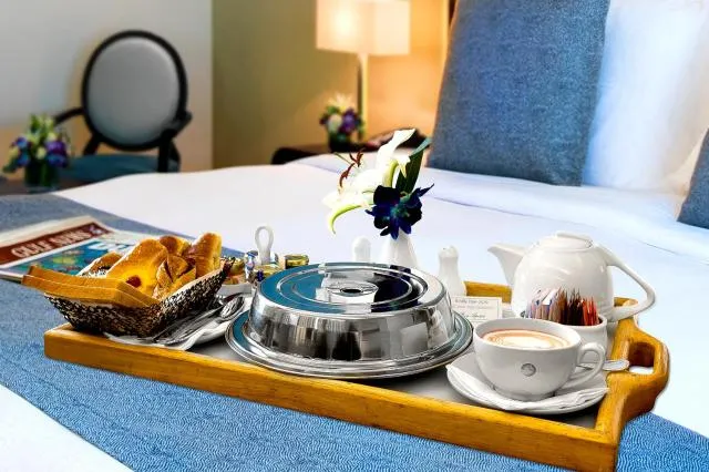  Elite Byblos Hotel - picture  : Bed,Coffee/tea facilities,Food and drinks,Bedroom,Food,Meals,Breakfast,Continental breakfast,room service,Property,Room 