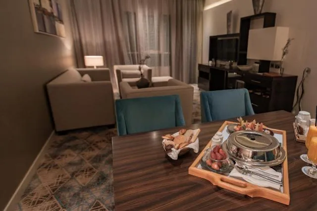  Elite Byblos Hotel - picture  : Night,Living room,Food and drinks,Seating area,Dining area,Food,Meals,Breakfast,Dinner,Drinks,Family,room service,Property 