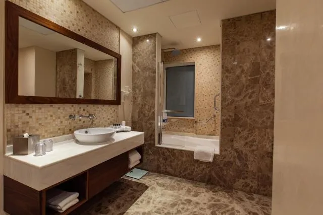  Elite Byblos Hotel - picture  : Shower,Toilet,Bathroom,Night,Bathroom,Bath,heating,towels,Property 