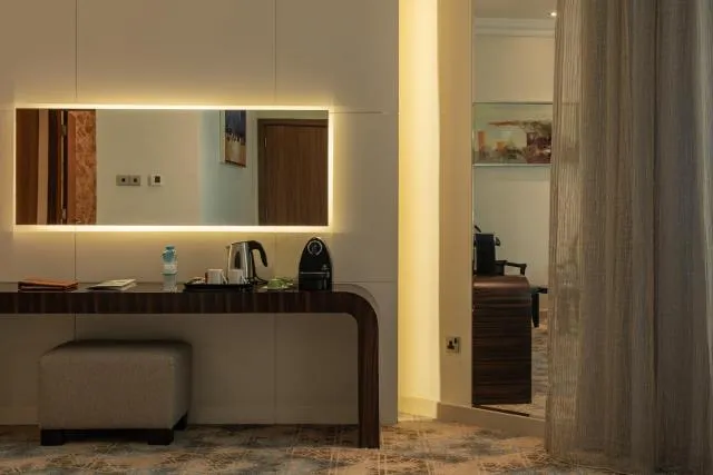  Elite Byblos Hotel - picture  : Kitchen/kitchenette,Night,Coffee/tea facilities,Decorative detail,Bedroom,Drinks,Property 
