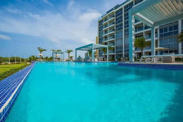  Stunning beachfront apartment with private jacuzzi - picture  : Property building,Swimming pool 