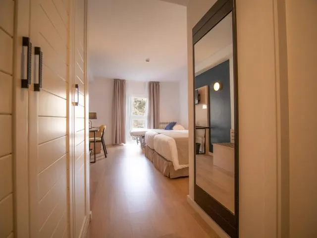  Hotel Roc Meler - picture  : Seating area,Bed,Photo of the whole room,Bedroom,wardrobe,Property,Room 