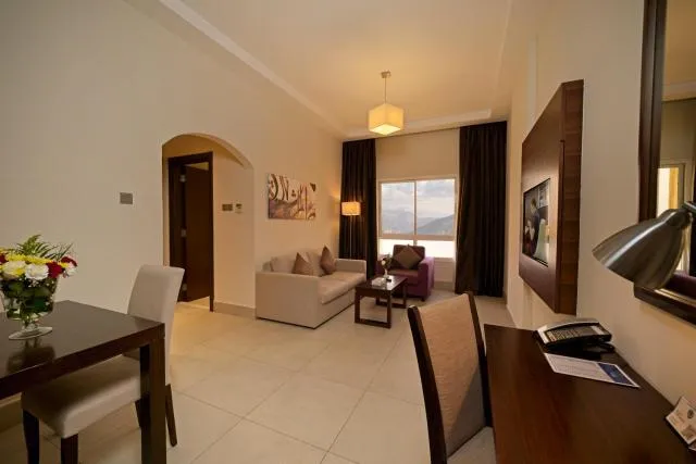  Action Hotel Ras Al Khaimah - picture  : Seating area,Living room,Seating area,Dining area,hair dresser,Property 