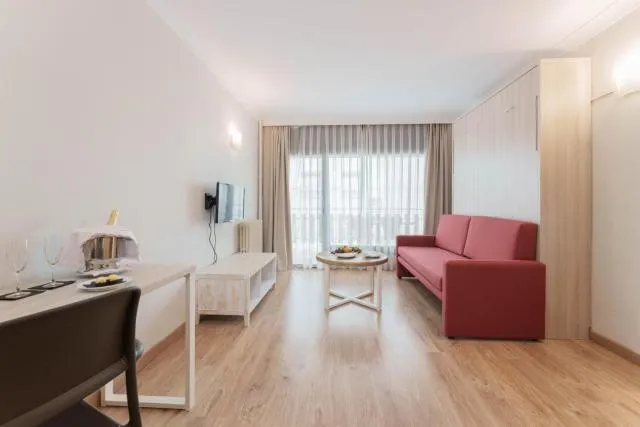  Hotel & Aparthotel Cosmos - picture  : Seating area,TV and multimedia,Living room,Photo of the whole room,Seating area,Property,Room 