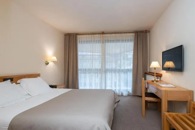  Hotel Bonavida - picture  : TV/entertainment centre,Bed,Bed,Room 