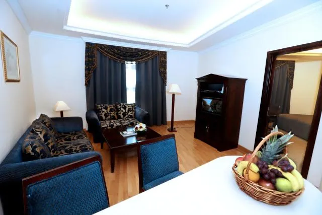  Sharjah Premiere Hotel & Resort - picture  : Seating area,Dining area,TV/entertainment centre,Food,Living room,Property 