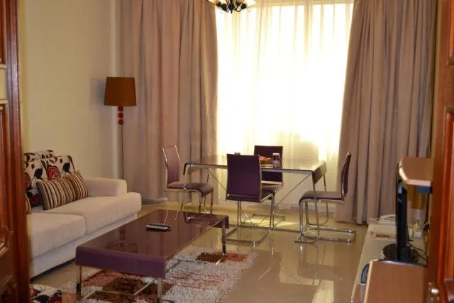  Abu Dhabi Plaza Hotel Apartments - picture  : Seating area,Day,Living room,Property 