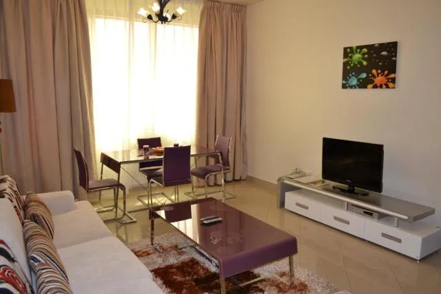  Abu Dhabi Plaza Hotel Apartments - picture  : Seating area,TV/entertainment centre,Day,Living room,Property 