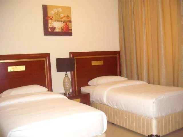  Abu Dhabi Plaza Hotel Apartments - picture  : Bed,Bed,Room 