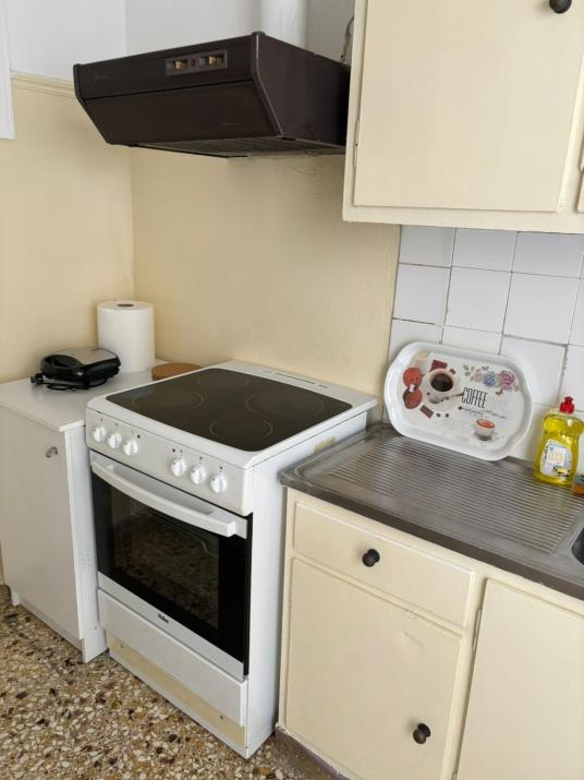 room with shared bath behind the kitchen
