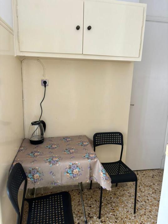 room with shared bath behind the kitchen