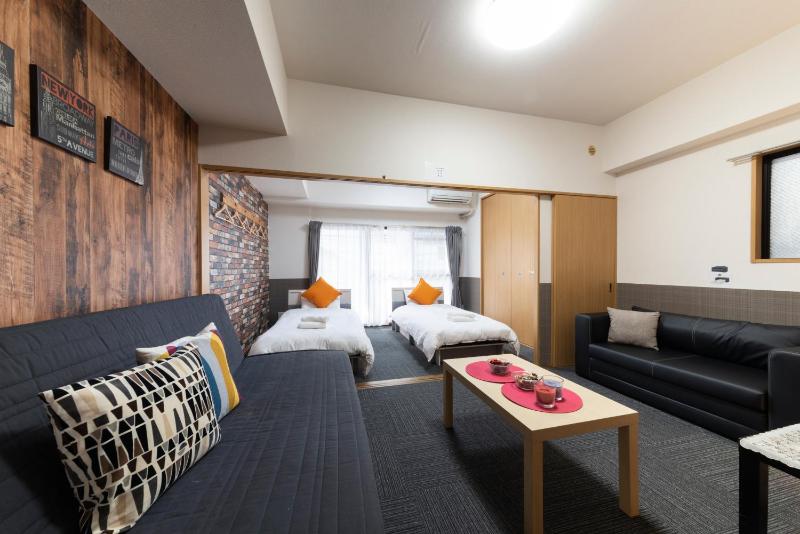 Grande Famille Shimanouchi Dotonbori Condo — отель с удобным расположением в Осаке