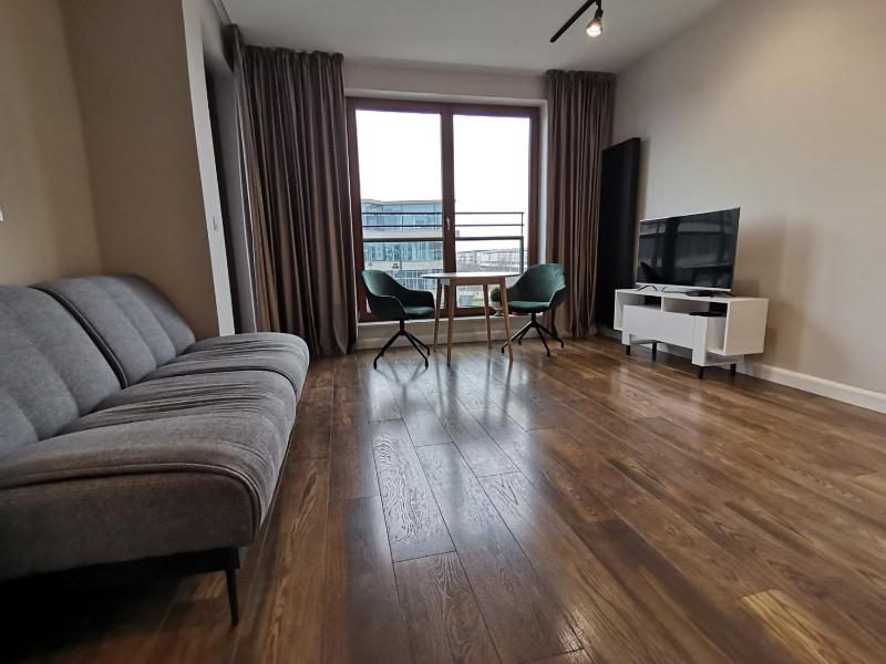 Nowoczesny Apartament z widokiem — забронировать отель в Варшаве