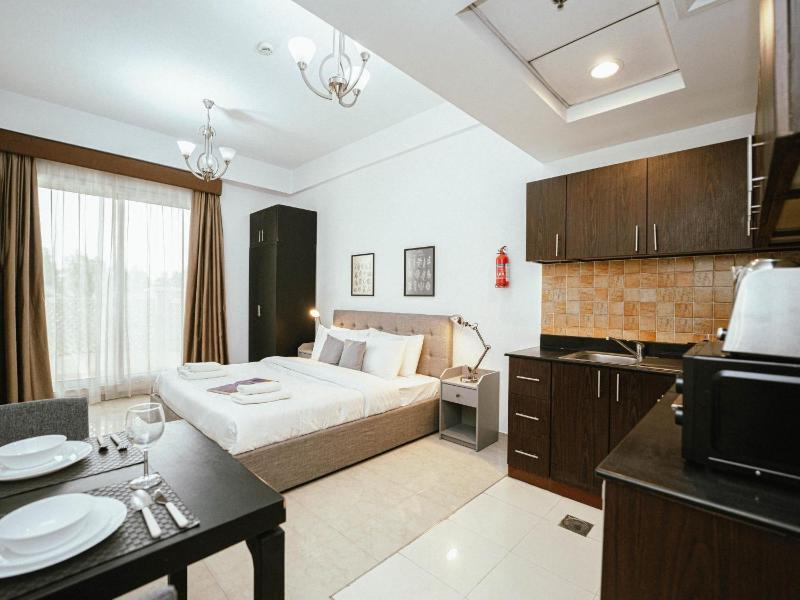 Classy Studio with big facilities in JVC — отель с удобствами в Дубае