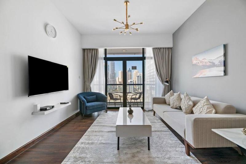 StoneTree - Chic & Modern 1BR — отель с удобствами в Дубае