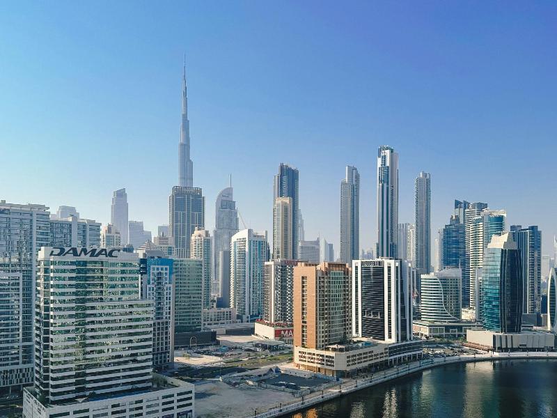 Waterfront apartment with Burj Khalifa views in Business Bay — отель с удобствами в Дубае