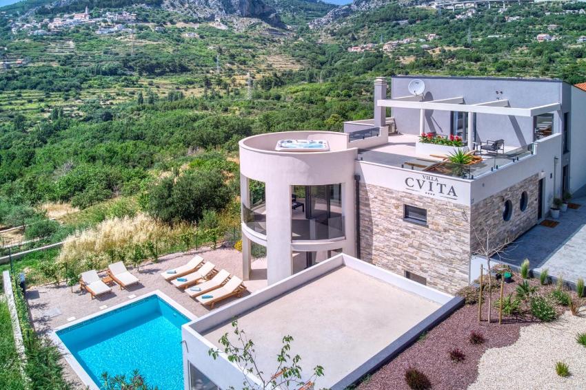VILLA CVITA is a modern 5-bedroom villa with a Jacuzzi, a Gym and Finnish Sauna, a heated pool, and amazing views